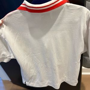 Burberry Polo white and red Stripes on shoulders .